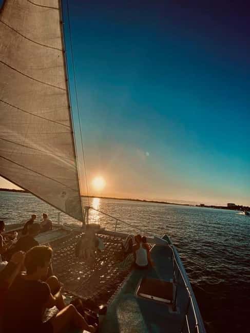 Sunset Cruise In Paradise - Raising the sail around Paradise Island